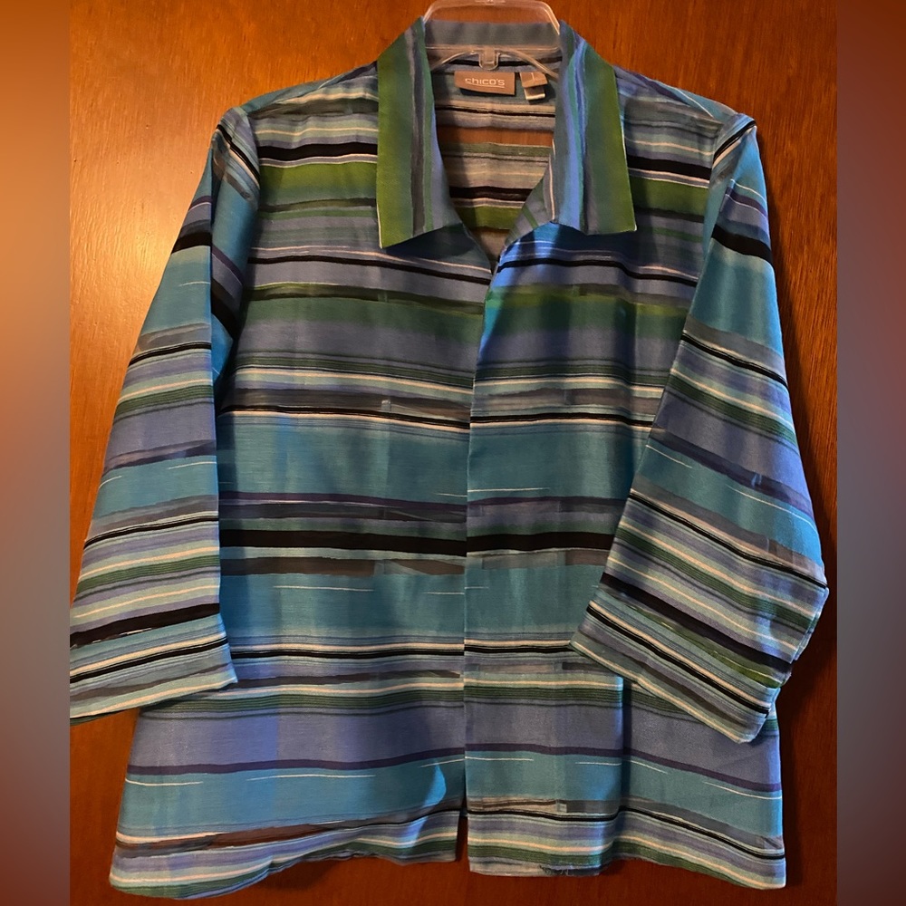 Chico size 1 ( runs larger like a size 8 ). Open front jacket, multi color.